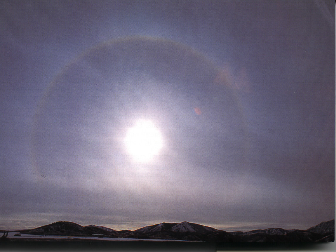 cirrostratus clouds with a halo around the sun