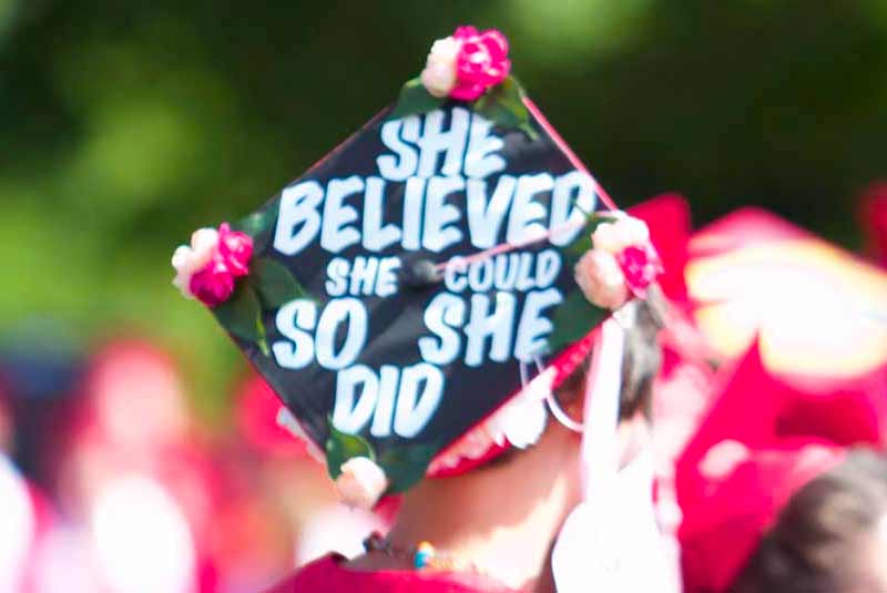 Graduate with grad cap that says She believed she could so she did