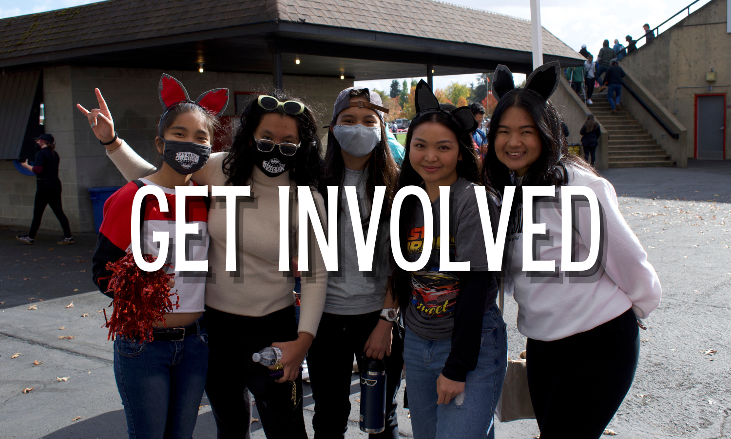 Students posed in a group with three out of the five students wearing Wolfie ears. The words "Get Involved" are superimposed over the group.