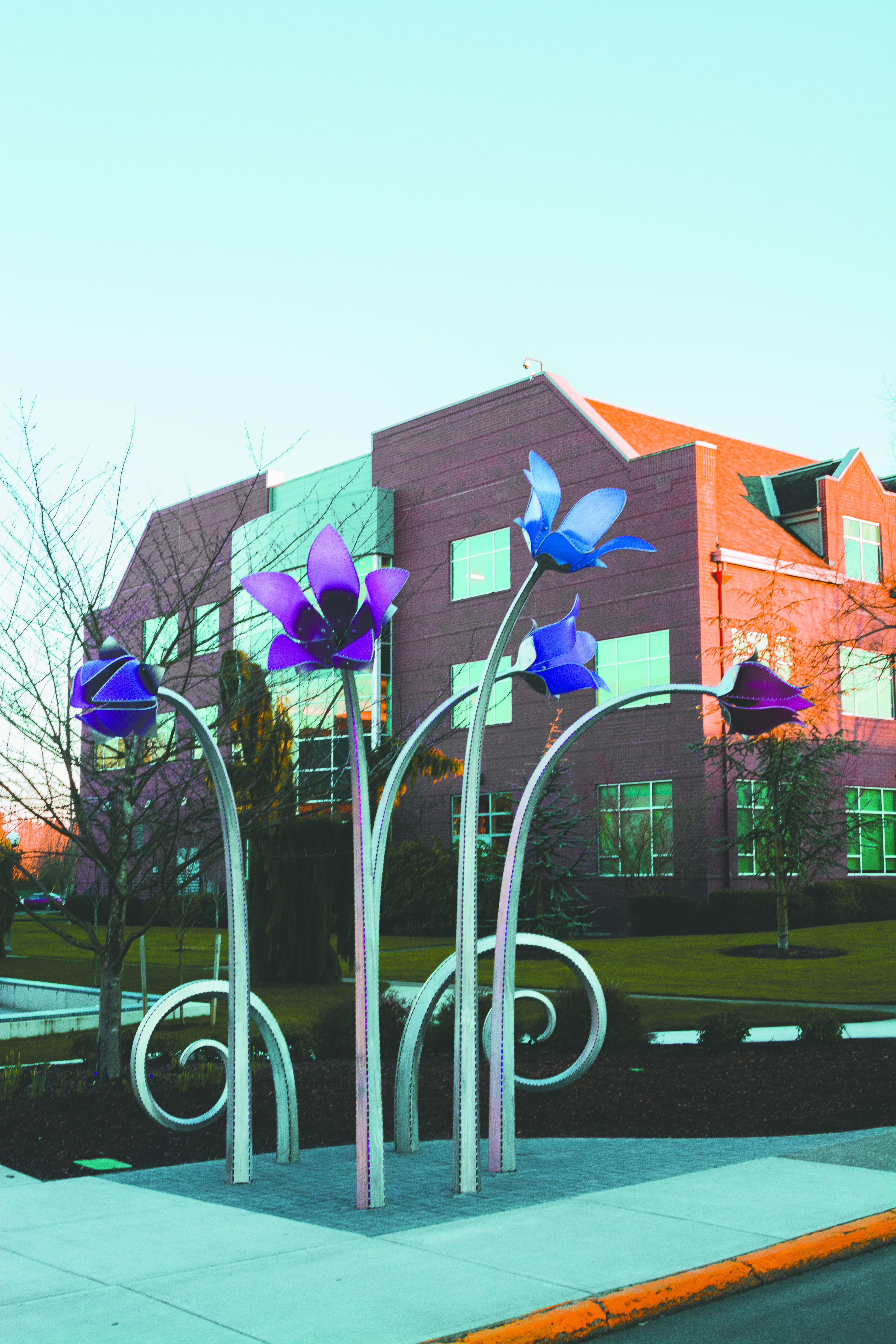 Flower sculpture springs to life in front of education center