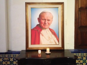 Picture of the pope inside of a Catholic church