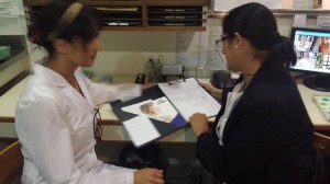 This is a picture of one of my lovely supervisors in the Sanatorio teaching me how the patient histories work and what they entail.
