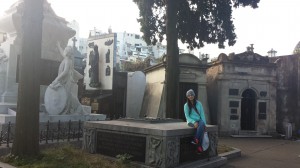 A picture of me surrounded by all the graves in the cemetery.